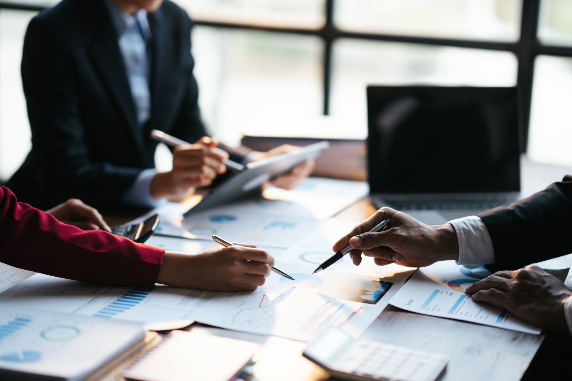 Business teamwork brainstorming meeting process. Business people discussing the charts and graphs